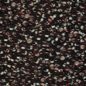 A Pile of Mint Green Lined Smoky Amethyst Drop Beads